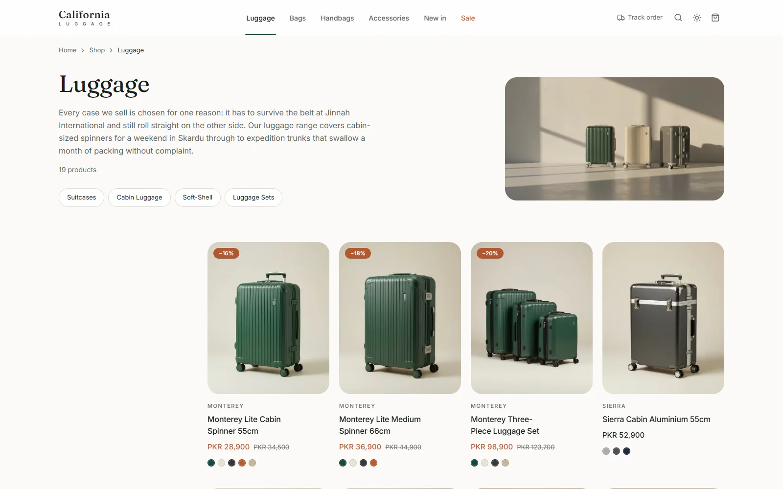 Luggage category page with sub-category filters and suitcases showing prices, sale badges and colour dots